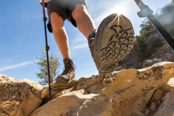 closeup of a person's boot on a rock.