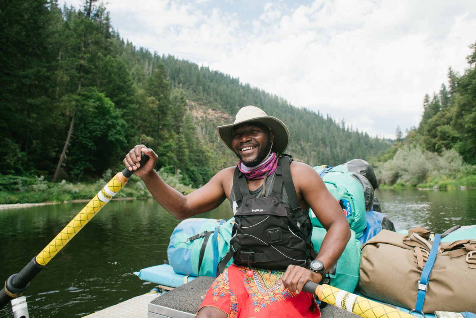 An OARS guide rows an oar raft on California's Lower Klamath River.