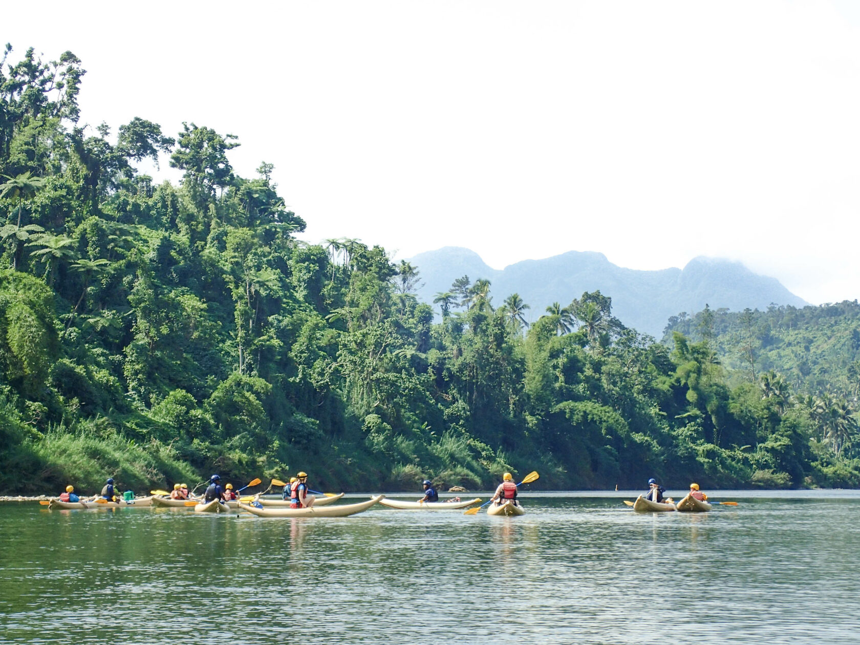 Group rafting down a river in Fiji.