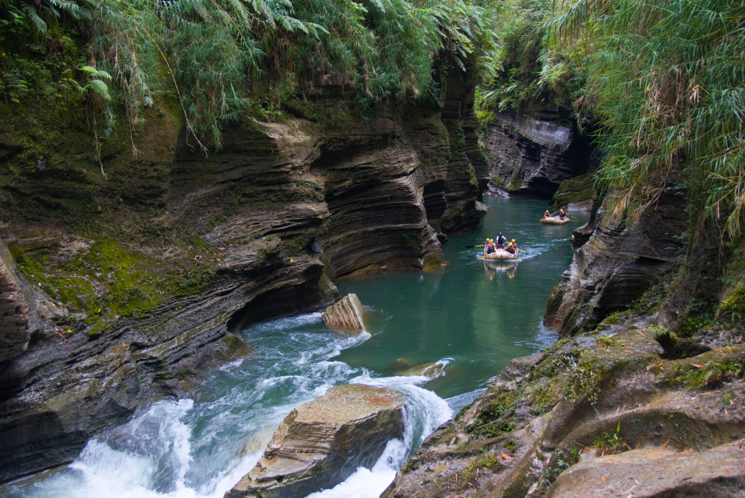 Group rafting down a river in Fiji.