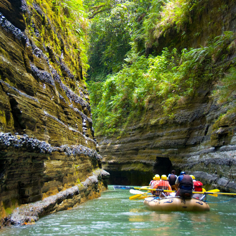 Group rafting down a river in Fiji.