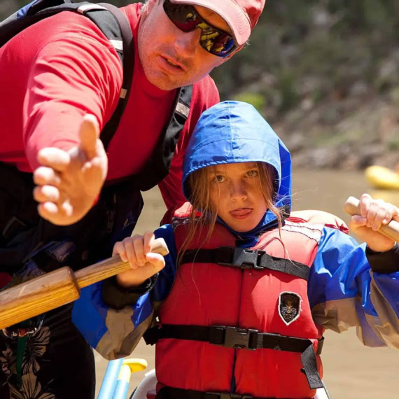 A guide helping a young traveler.
