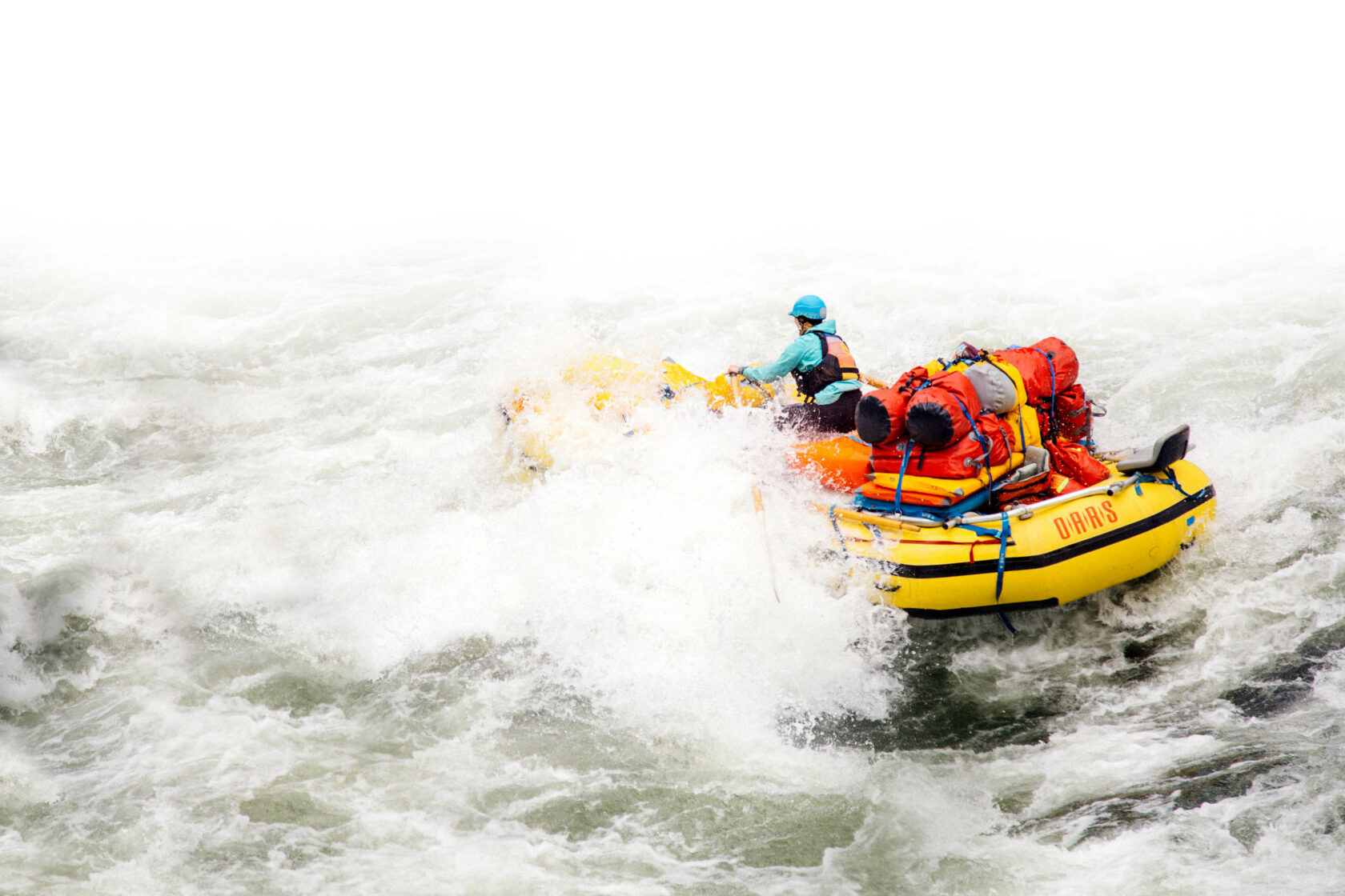 Group of rafters navigating white waters in an Idaho river.