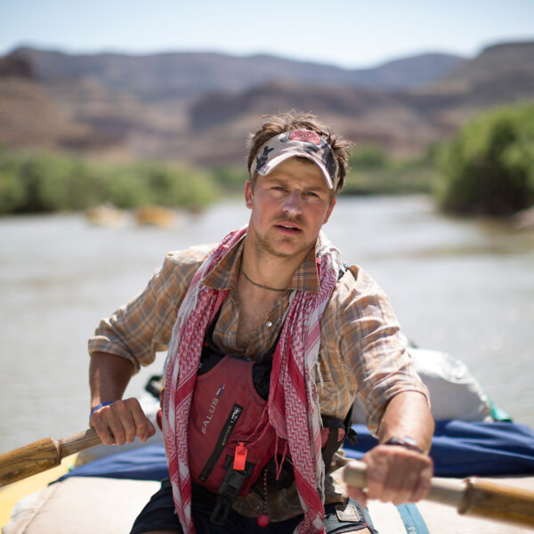 A guide rows on wooden oars down the Lower Green River Rowing Clinic.