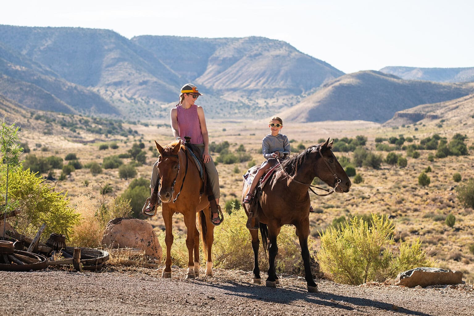 A mom and daughter on horseback at Bar 10 Ranch