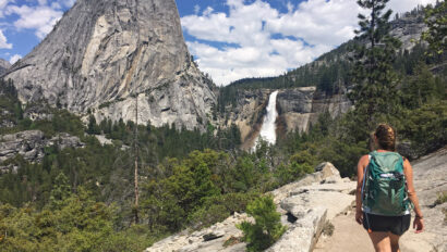 Hiker approaches the top of Nevada Falls in Yosemite