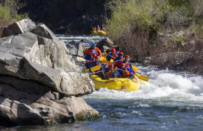 A group of whitewater rafters going through Hospital Bar Rapid on the South Fork of the American River