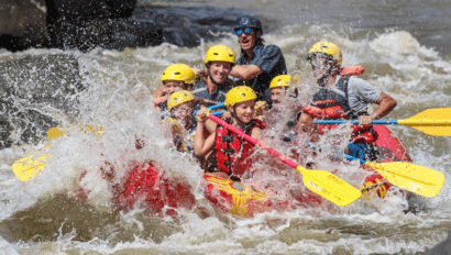 A group of rafters splashes through a rapid on the Rio Grande River in New Mexico.